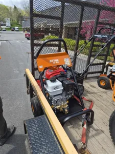 New STIHL RB 400 pressure washer secured on a trailer at West Point Cemetery for grounds maintenance and cleaning operations.