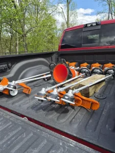 New STIHL string trimmers and safety equipment stored in a truck bed at West Point Cemetery for grounds maintenance operations.