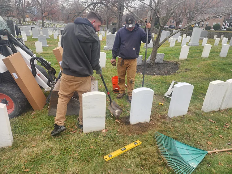 Supply Chain Management contractors providing lawn care service at West Point Cemetery